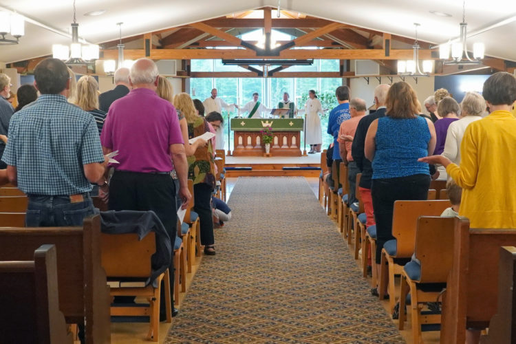 People praying at church service
